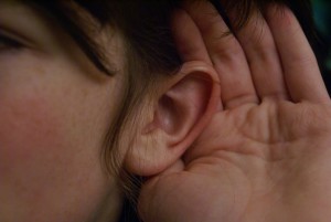 listening with cupped ear