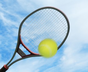 tennis racket hitting ball